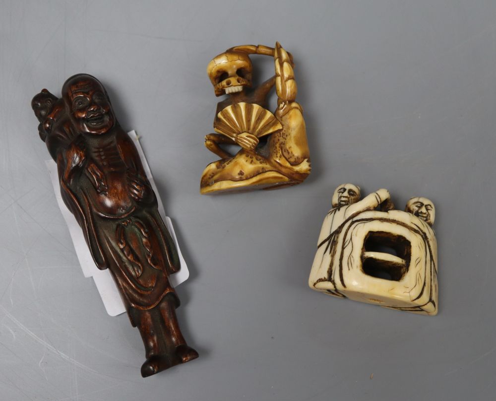 Two Japanese ivory netsuke/okimono carvings and a hardwood figural netsuke, longest 9cm